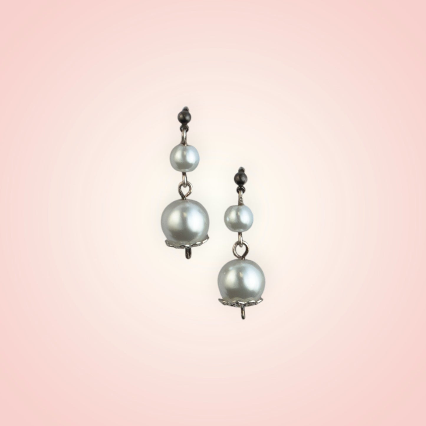 Earrings with two dangling pearls