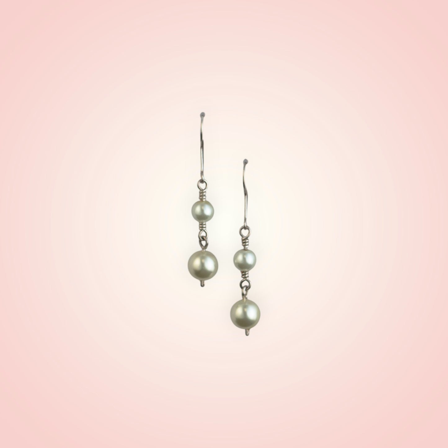 Earrings with two dangling pearls