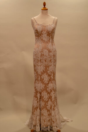 Exclusive French lace wedding dress with beige lining.