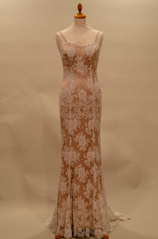 Exclusive French lace wedding dress with beige lining.