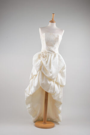 Cream corset dress with an asymmetric organza bubble skirt