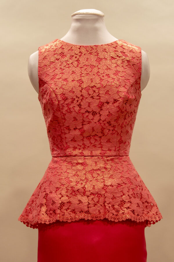 Coral-pink lace top with peplum