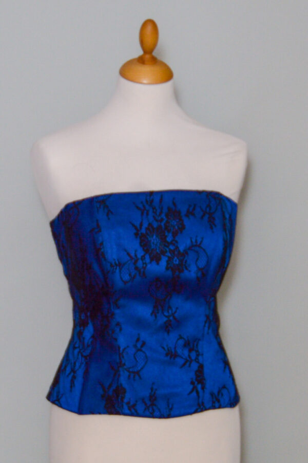 Blue corset covered with black lace