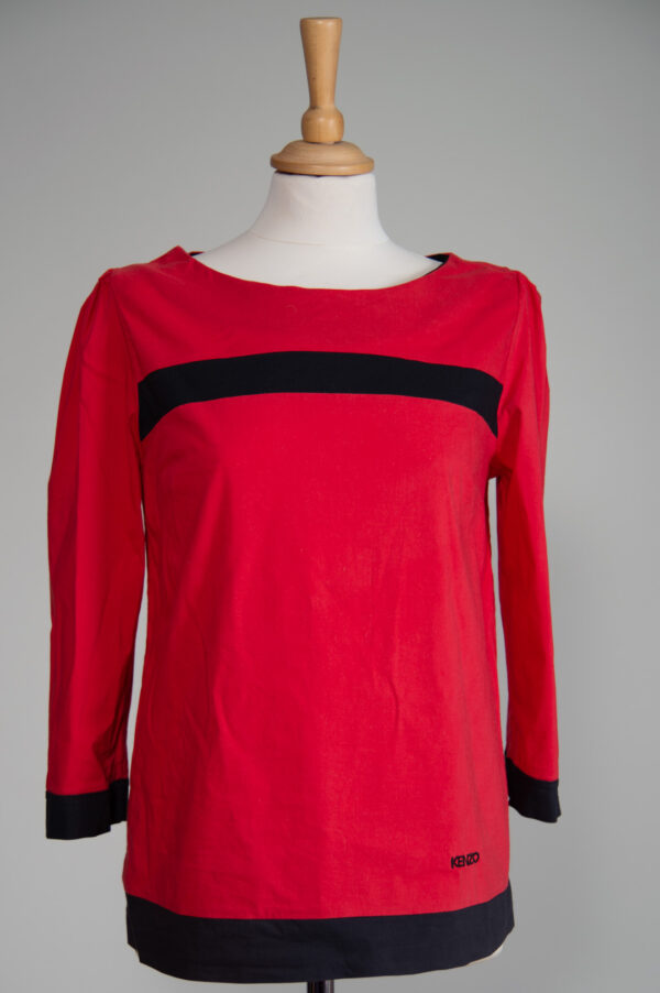 red blouse with black trims