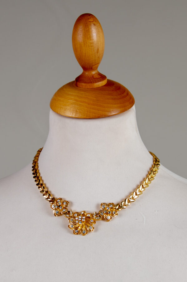 Massive gold plated necklace with three large flowers.