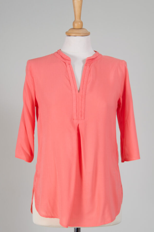 coral-pink loose-fit tunic