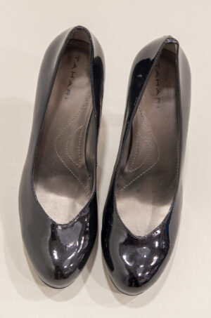 Black patent leather round toe platform shoes.