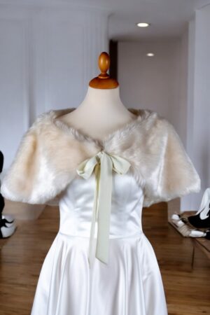 Natural white faux fur short cape.