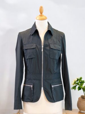 Sporty thin jacket made of black impregnated fabric.