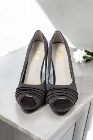 Black satin open-toe shoes.