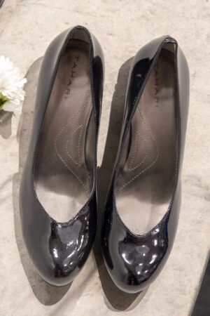 Black patent leather round toe platform shoes.