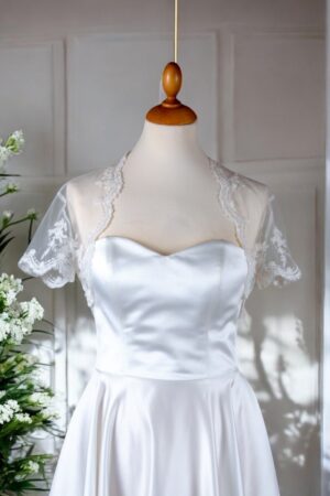 Festive natural white lace bolero for the bride.