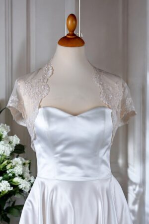 Festive natural white lace bolero for the bride.