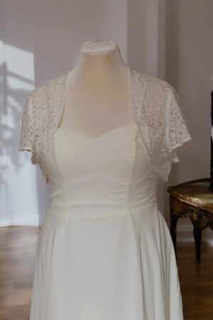 Festive natural white lace bolero for the bride.