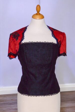 festive red bolero with black lace trim