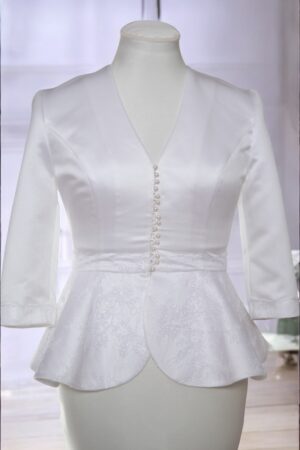 Formal white satin jacket with peplum for the bride.