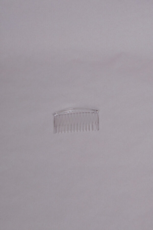 transparent comb for attaching a bridal veil or other decorations to the hair