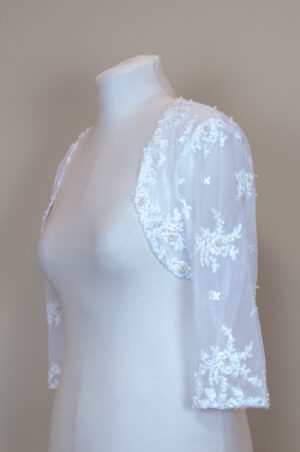 festive white bolero decorated with pearl beading