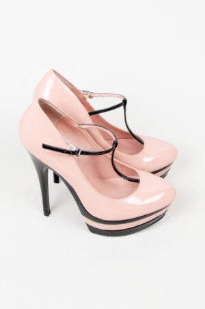 Pink and black patent leather platform shoes.