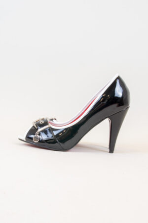 Black patent leather shoes with white edges.