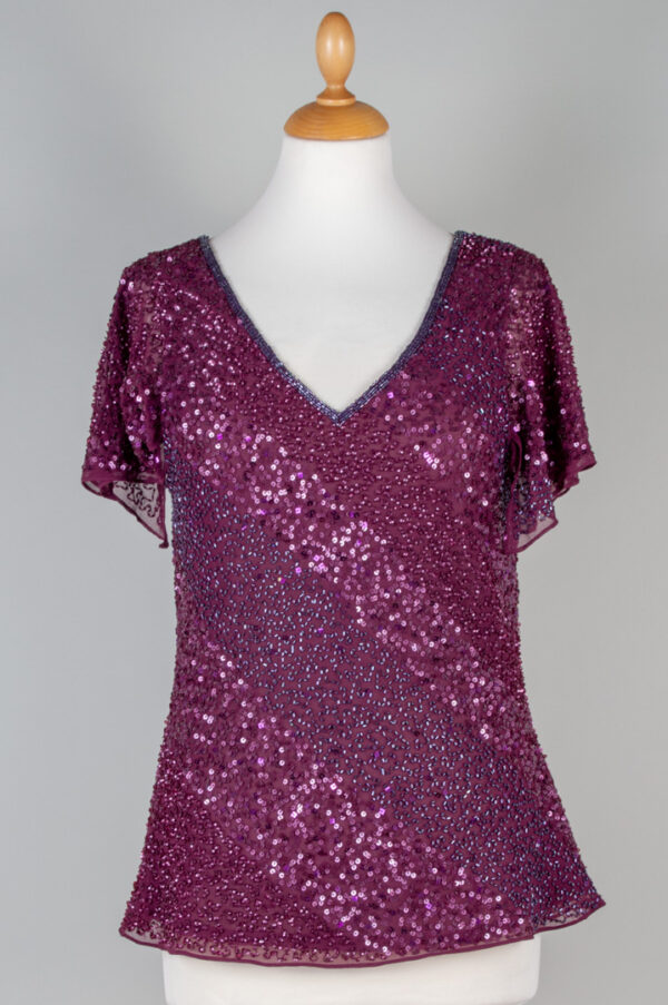 festive top decorated with sequins and beads