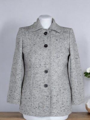 Vintage look jacket is made of grey tweed.