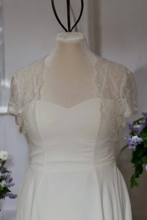 Festive natural white lace bolero for the bride.