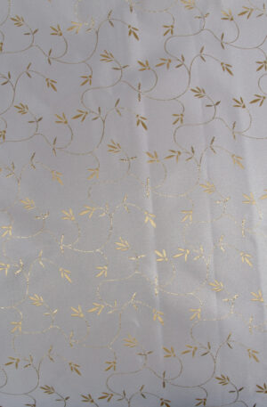 festive creamy brocade fabric with golden patterning