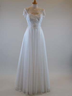 off-white wedding dress with a fluffy tulle skirt