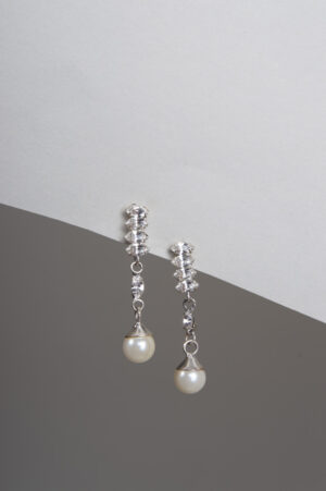 Dangling pearl and crystal earrings.