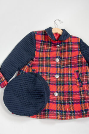 A little girl's coat and beret.