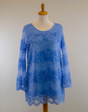 Light blue lace tunic with long sleeves and straight cut.