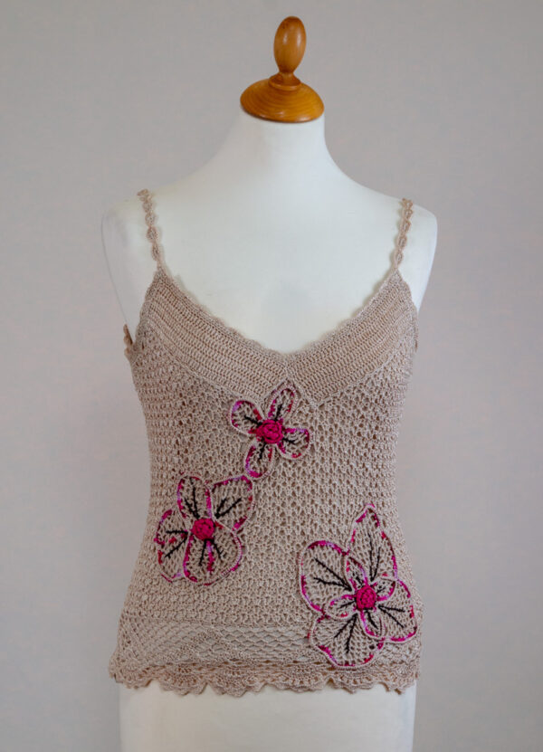 Crochet tank top with shoulder straps.