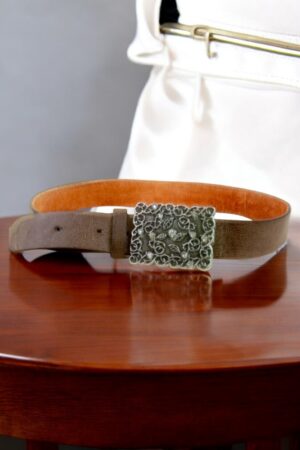 A belt with a buckle embellished with sparkling stones.