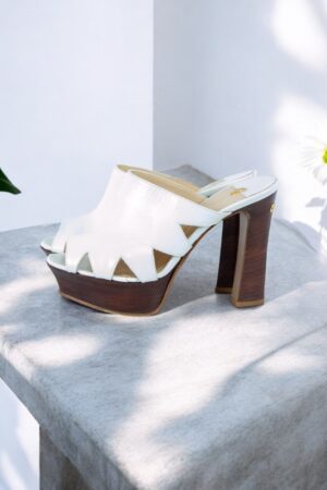 Exclusive high heel white platform sandals.