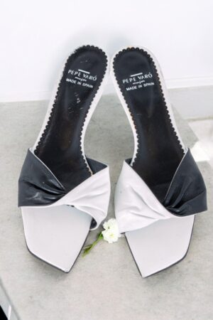 Black and white low-heeled summer shoes.