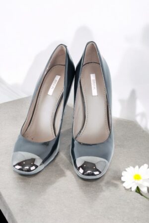 High-heeled patent leather shoes.