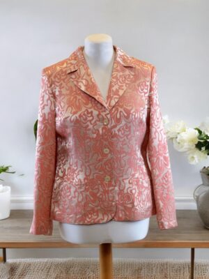 Summer costume jacket with a coral pink pattern.