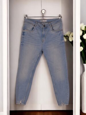 Zara light blue mid-length jeans for women.