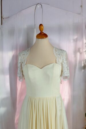 Festive natural white lace bolero for the bride.