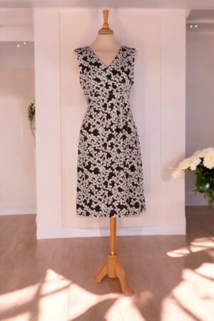 Black and white empire cut knit dress with asymmetrical design.