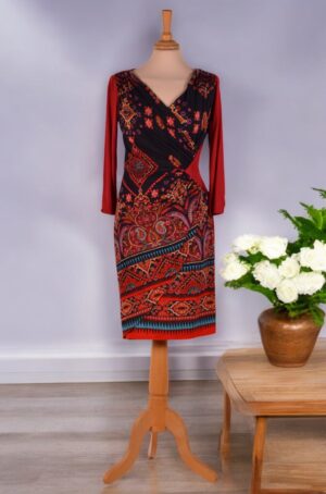 Asymmetrical design multi-colored knit dress with half-length sleeves.